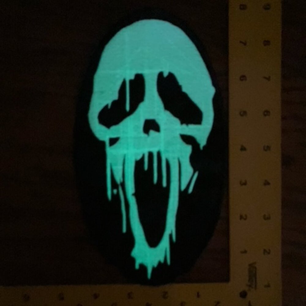 Mr. Ghostface melting mask glow-in-the-dark sew on only patch. Glows green